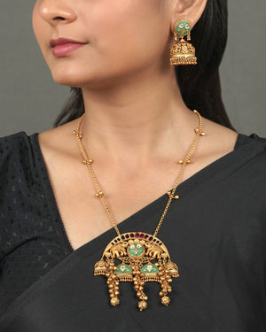 Exclusive Golden Heritage Pendant Set for Festive Collection styled in traditional golden jewellery display