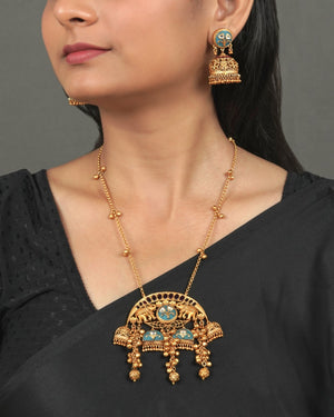 Exclusive Golden Heritage Pendant Set for Festive Collection styled in traditional golden jewellery display