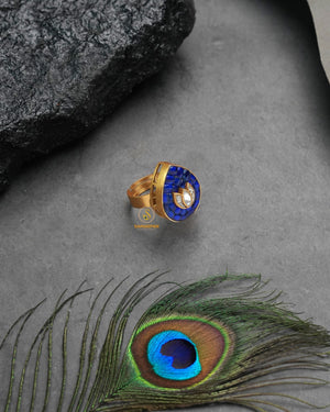 Festive golden heritage ring with celebratory traditional charm