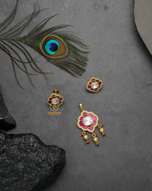 Ruby color pearl-accented grace jadau kundan pendant set with matching earrings