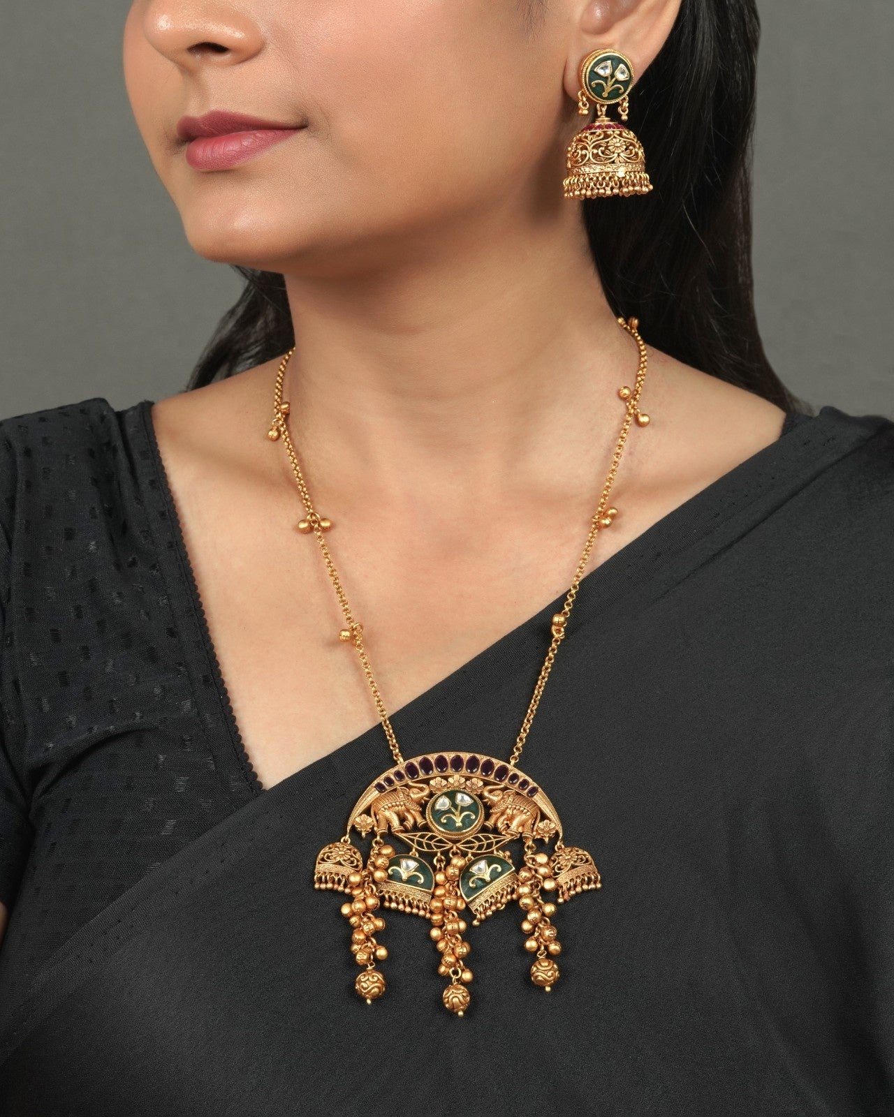 Exclusive Golden Heritage Pendant Set for Festive Collection styled in traditional golden jewellery display
