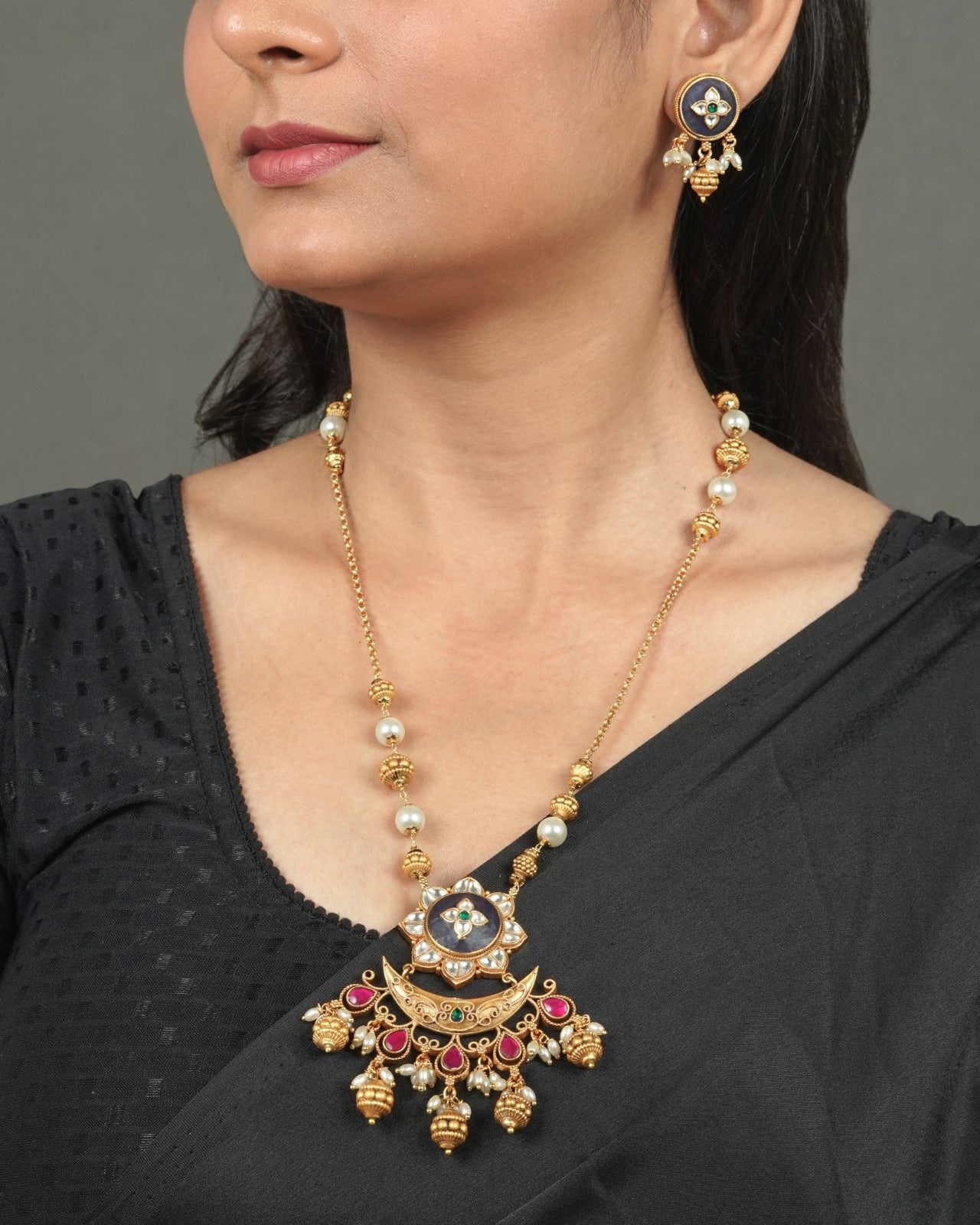 Statement Golden Heritage Pendant Set for Grand Celebrations styled in traditional golden jewellery display