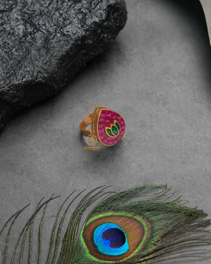 Festive golden heritage ring with celebratory traditional charm