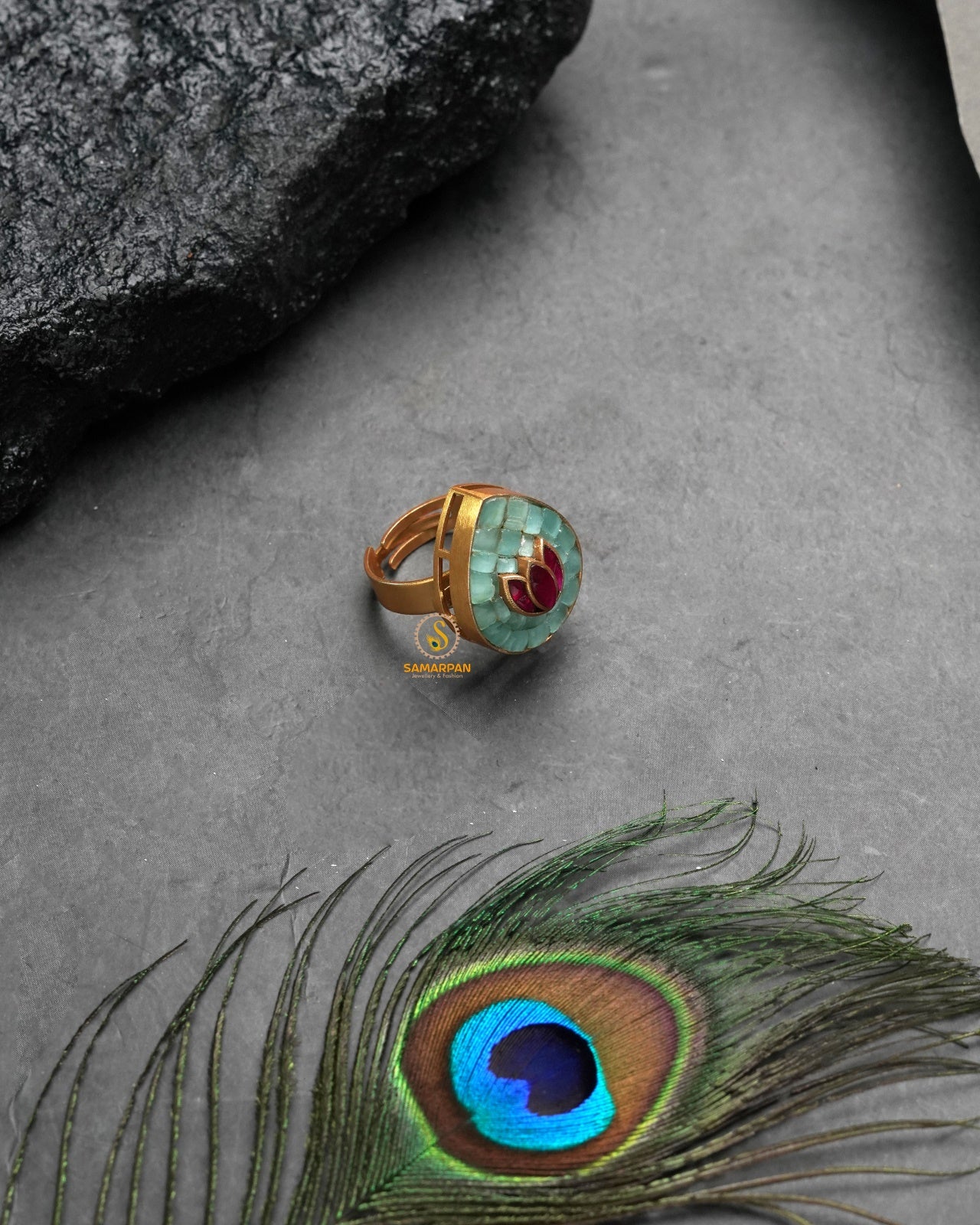 Festive golden heritage ring with celebratory traditional charm