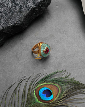 Festive golden heritage ring with celebratory traditional charm