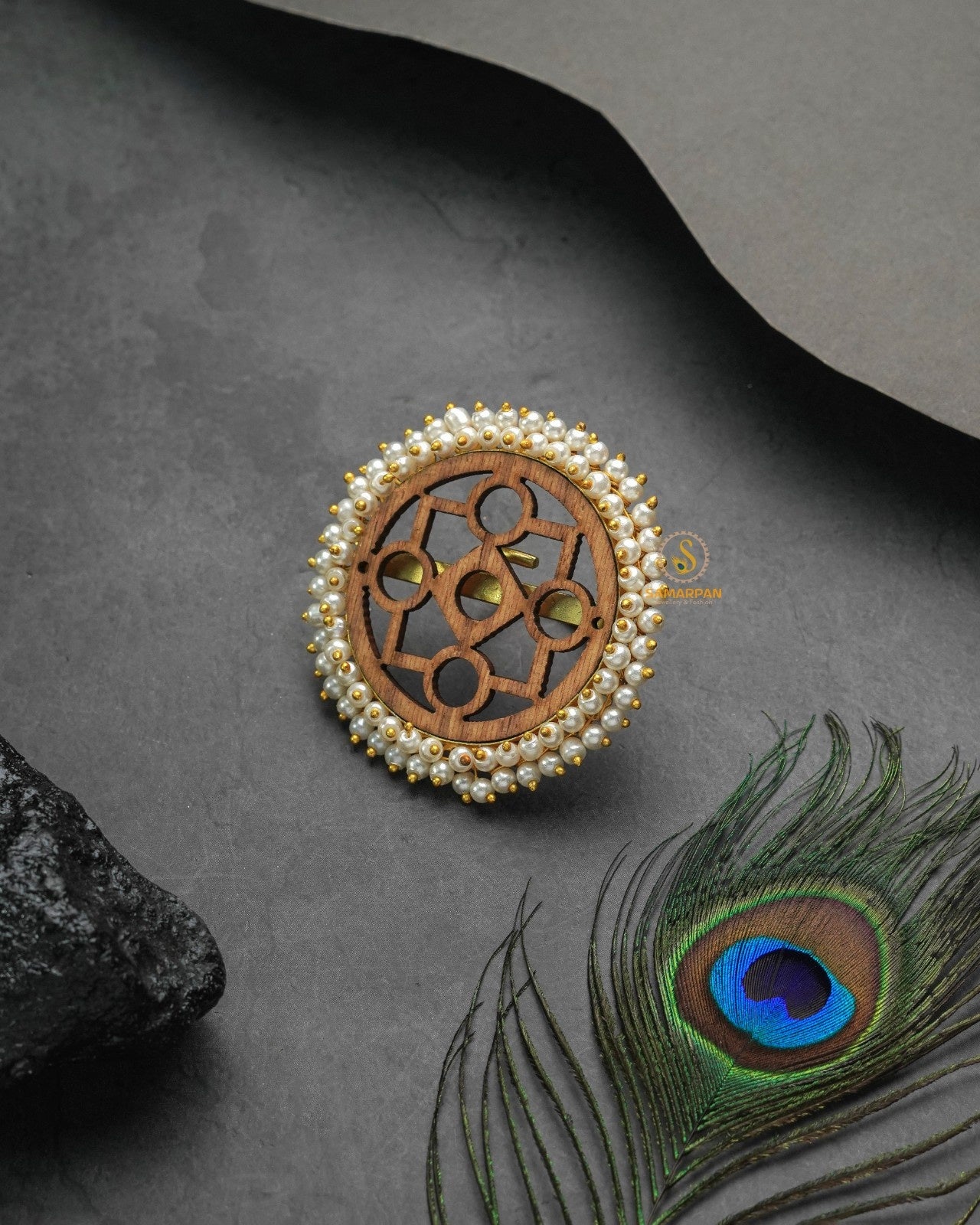 Festive metallic golden glow ring paired with joyful celebratory styling