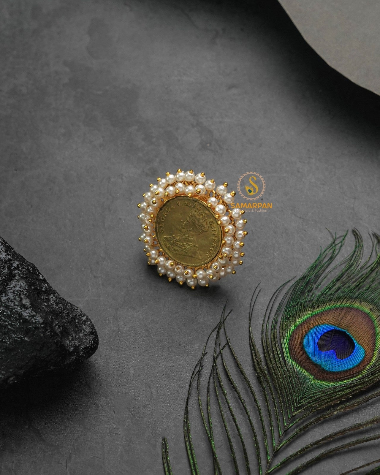 Festive metallic golden glow ring paired with joyful celebratory styling
